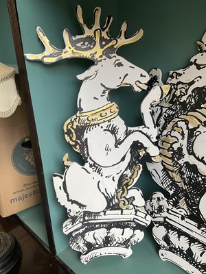 Lot 5169 - Set of four stylish hand painted dummy boards, in the form of busts of heraldic beasts