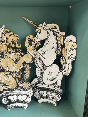 Lot 5169 - Set of four stylish hand painted dummy boards, in the form of busts of heraldic beasts