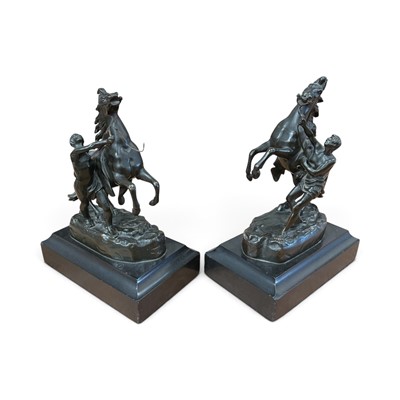 Lot Pair of late 19th century bronze Marley horses on black slate bases, approximately 27cm in overall height (2).