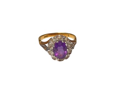 Lot 27 - Amethyst and diamond oval cluster ring in 18ct gold setting