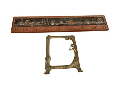 Lot 5241 - Art Nouveau style brass frame and a kitchen utensil hanger with copper relief plaque (2)