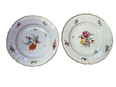Lot 5247 - Pair of Royal Copenhagen porcelain moulded plates, polychrome painted with floral sprays, underglaze blue marks, 23cm diameter