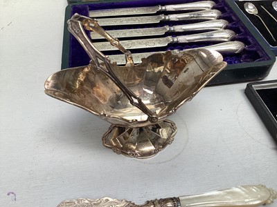 Lot 5274 - Group of silver to include a silver bon bon dish, silver cased spoons etc