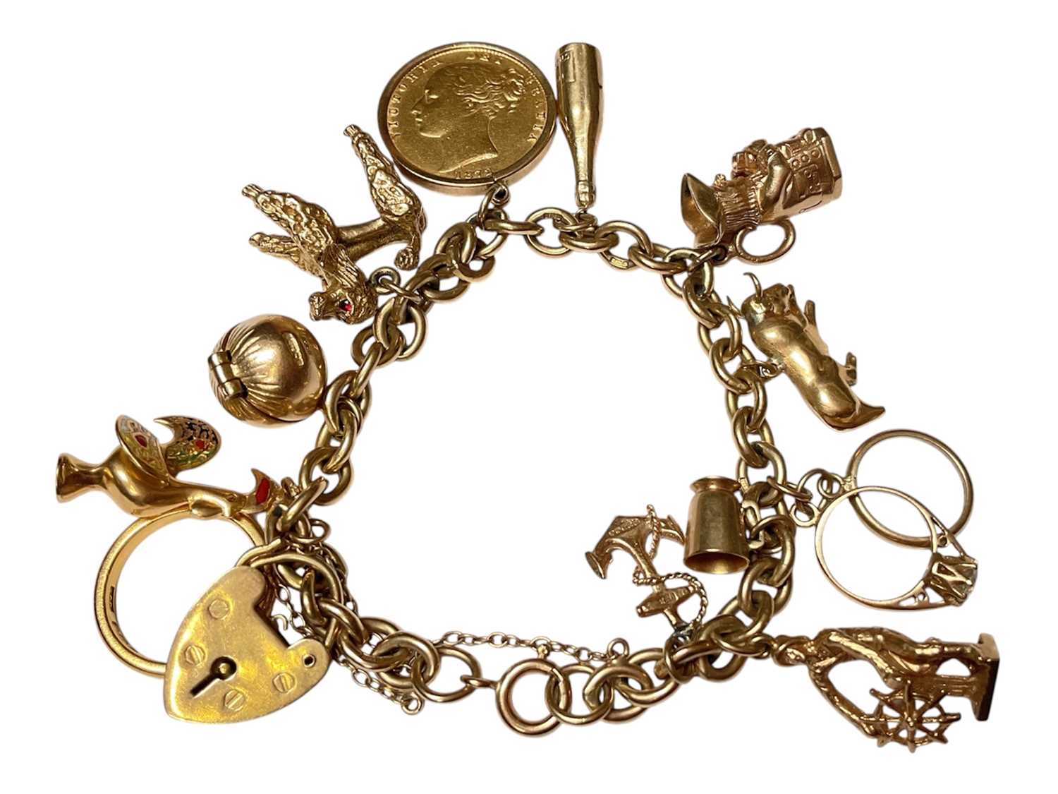 Lot 51 - Gold charm bracelet with a Victorian gold full sovereign 1872, 22ct gold wedding ring, various 9ct gold charms etc