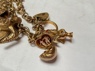 Lot 51 - Gold charm bracelet with a Victorian gold full sovereign 1872, 22ct gold wedding ring, various 9ct gold charms etc