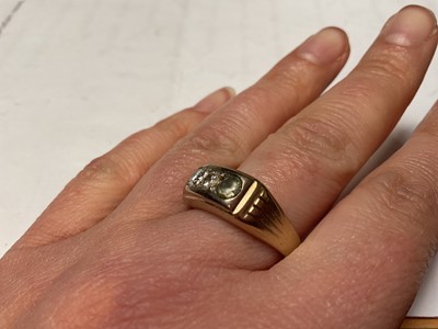 Lot 56 - Three stone ring with two diamonds and one synthetic replacement stone, in yellow metal setting, stamped 750.