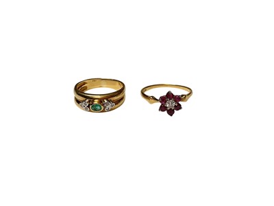 Lot 48 - Emerald and diamond ring in yellow metal setting, stamped 750, together with a ruby and diamond cluster ring, stamped 18ct. (2)