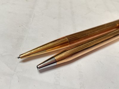 Lot 47 - Montblanc gold plated propelling pencil and a Cross gold plated ball point pen (2)
