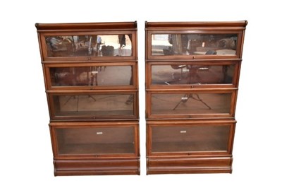 Lot 1340 - Near pair of early 20th century four section mahogany Globe Wernicke bookcases