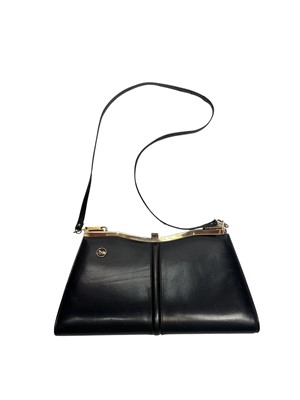 Lot 2536 - Vintage Celine navy leather handbag with horse and carriage metal logo.