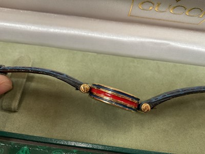 Lot 38 - Group of costume jewellery, some silver jewellery and various watches including a Gucci wristwatch with red and blue enamel decoration and a blue leather strap in case