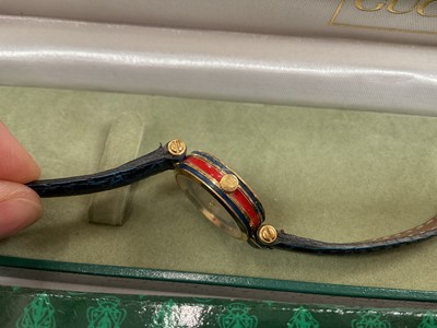 Lot 38 - Group of costume jewellery, some silver jewellery and various watches including a Gucci wristwatch with red and blue enamel decoration and a blue leather strap in case