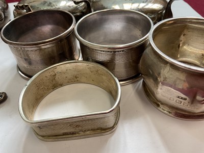 Lot 85 - Pair of Victorian silver cauldron salts, one other silver salt, silver condiment pot, four various silver salts spoons and four silver napkin rings