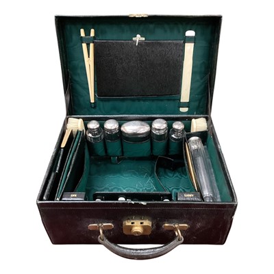 Lot 832 - Late 19th century leather dressing table box with silver and ivory fittings