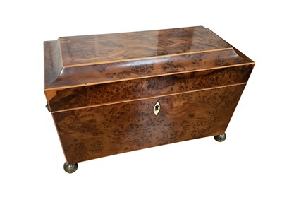 Lot 5008 - Victorian walnut tea caddy, of sarcophagus form, with brass lion mask and ring handles and bun feet, with boxwood inlay and bone escutcheon, the interior with engraved glass liner flanked by tin...