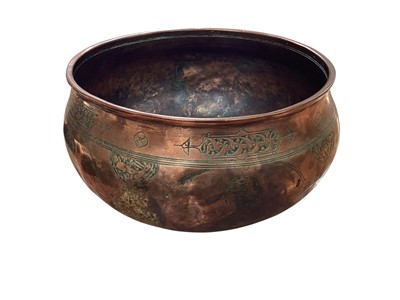 Lot 5011 - Antique Middle Eastern copper bowl with Arabic script, engraved with foliate decoration and roundels containing animals, the rim 26cm diameter