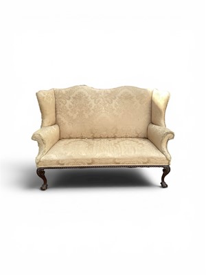 Lot 5316 - Ewardian mahogany framed wing back sofa with beige upholstery, 164cm wide, 107cm high