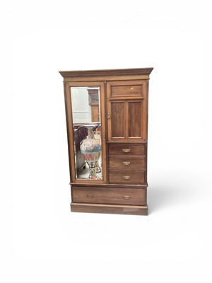 Lot 5315 - Edwardian walnut wardrobe with bevelled mirror door, cupboard and three short drawers, with a further London drawer below, 122cm wide, 57cm deep, 205cm high