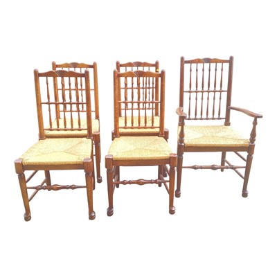 Lot 5322 - Set of five oak spindle back chairs with rush seats on tuned front legs joined by stretchers