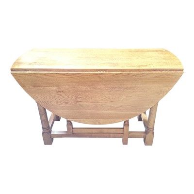 Lot 5324 - Oak drop leaf dining table on turned and block legs joined by stretchers, 123cm x 51cm
