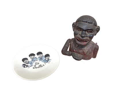 Lot 5036 - Novelty cast iron figural money box, and a Beatles plate (2)