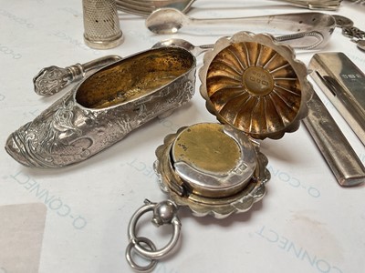 Lot 25 - Group of silver items to include an Edwardian novelty shoe, Victorian sovereign holder, tea strainer, fork, pair of sugar tongs, thimble etc, three Chinese silver teaspoons
