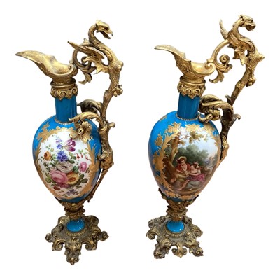 Lot 5062 - Pair of 19th century French porcelain urns with ormolu mounts, polychrome painted with figural and floral panels on a bleu Celeste ground with gilt borders, 37cm high