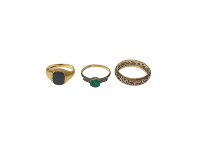 Lot 57 - 9ct gold onyx signet ring, 9ct gold and silver paste set ring and a gem set eternity ring (3)