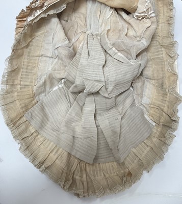 Lot 2500 - Exquisite 1882 wedding dress, cream satin silk with multi pleated trims, lace and tiny faux pearls to cuffs, hem and train. Front has boned bodice , ruched cream silk brocade panel with bow det...