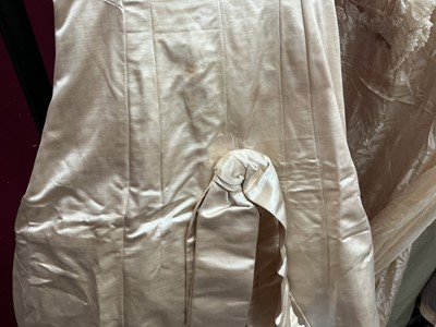 Lot 2500 - Exquisite 1882 wedding dress, cream satin silk with multi pleated trims, lace and tiny faux pearls to cuffs, hem and train. Front has boned bodice , ruched cream silk brocade panel with bow det...