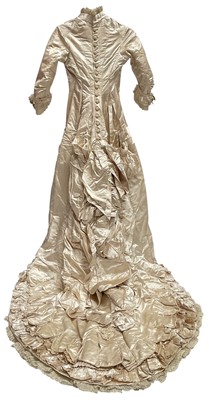 Lot 2500 - Exquisite 1882 wedding dress, cream satin silk with multi pleated trims, lace and tiny faux pearls to cuffs, hem and train. Front has boned bodice , ruched cream silk brocade panel with bow det...