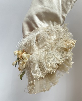 Lot 2500 - Exquisite 1882 wedding dress, cream satin silk with multi pleated trims, lace and tiny faux pearls to cuffs, hem and train. Front has boned bodice , ruched cream silk brocade panel with bow det...