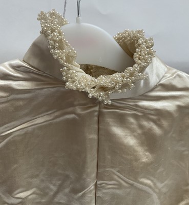 Lot 2500 - Exquisite 1882 wedding dress, cream satin silk with multi pleated trims, lace and tiny faux pearls to cuffs, hem and train. Front has boned bodice , ruched cream silk brocade panel with bow det...