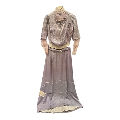 Lot 2504 - 1911 matching bodice and skirt in lilac silk by Snell & Power Clifford Street / Bond Street Lodon. Bodice is embroidered and beaded and with embroidered and beaded buttons. Net inserts to co...