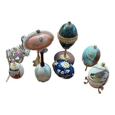 Lot 5095 - Box of hand decorated and jewelled eggs, one pierced and mounted with butterflies