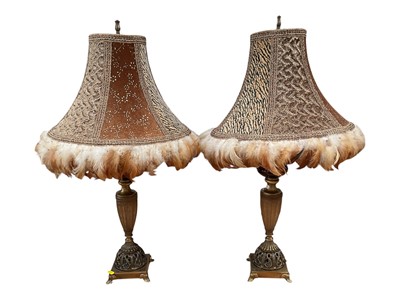 Lot 5120 - Pair of brass lamps with faux leopard skin and feathered shades, 80cm high