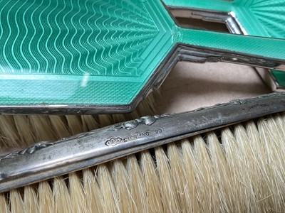 Lot 44 - Sterling silver mounted brush (stamped sterling 70) and a three piece silver plated and green guilloche enamel dressing table set