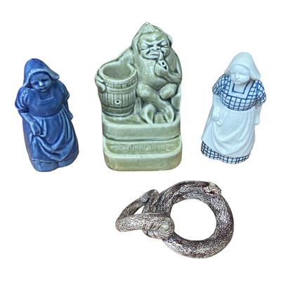 Lot 5110 - Two Doulton Dutch figures, spill holder and a pottery snake