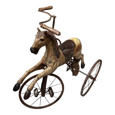 Lot 5157 - Victorian style carved wooden rocking horse tricycle with leather saddle, 85cm tall x 80cm long