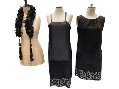Lot 2517 - 1920s Flapper dress in black silk crepe, heavily beaded with beaded tassels, 1920s long black gown with silk and lace panels, cut-out front and back with tassels, bare shoulders, tassels to sl...