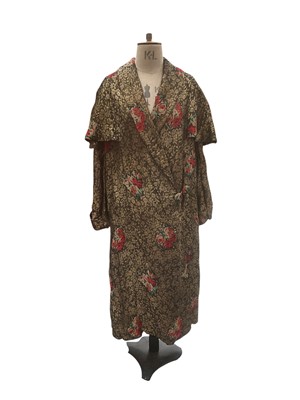 Lot 2521 - 1920s / 30s evening coat gold tone metallic thread in scrolling flora design interspersed with colourful printed roses, lined with floral velvet devore. Two large button fastening.