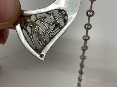 Lot 14 - Egyptian white metal and blue stone scarab beetle pendant necklace with pierced and carved white metal panels depicting birds and Egyptian figures