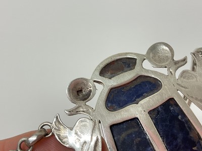 Lot 14 - Egyptian white metal and blue stone scarab beetle pendant necklace with pierced and carved white metal panels depicting birds and Egyptian figures