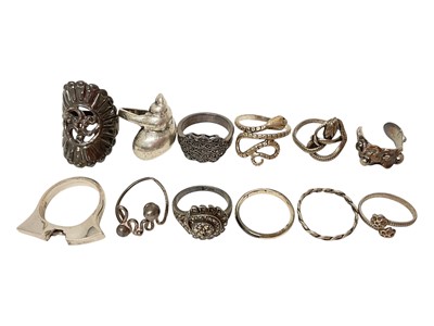 Lot 18 - Twelve silver / white metal rings including marcasite, two coiling snake rings, shell ring etc
