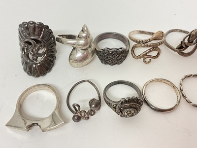 Lot 18 - Twelve silver / white metal rings including marcasite, two coiling snake rings, shell ring etc