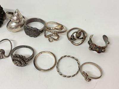 Lot 18 - Twelve silver / white metal rings including marcasite, two coiling snake rings, shell ring etc