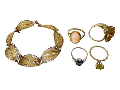 Lot 19 - Continental silver gilt (800) ram's head ring with wrap around scroll design shank, silver gilt filigree panel bracelet and three other rings