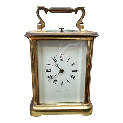 Lot 5169 - Large brass cased carriage clock retailed by Graham Nash, with alarm and repeater, 15cm high including handle