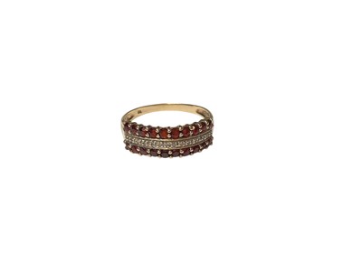 Lot 50 - Diamond and garnet ring with a triple band of stones, in 9ct gold setting