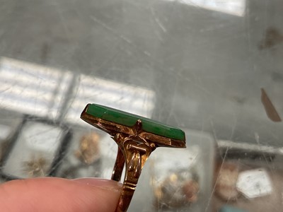 Lot 92 - Chinese yellow metal jade / green hardstone panel ring, stamped 14k, size L